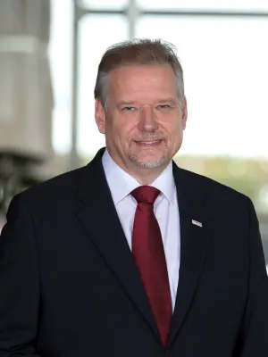 Daniel Korioth in a modern office, smiling and relaxed.